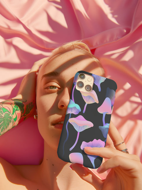 Aesthetic phone case featuring pastel neon mushrooms on a black background. The botanical-inspired design is available for iPhone, Samsung, and Google Pixel models. Glossy or matte finish options with durable, dual-layer protection.